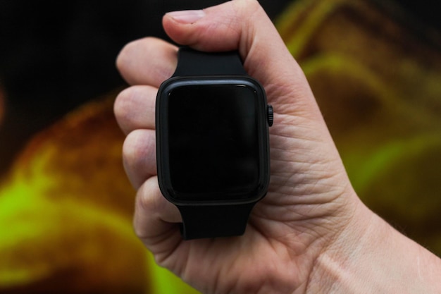 Close up shot of a businessmans hand that uses a smart watch to view incoming messages and calls to