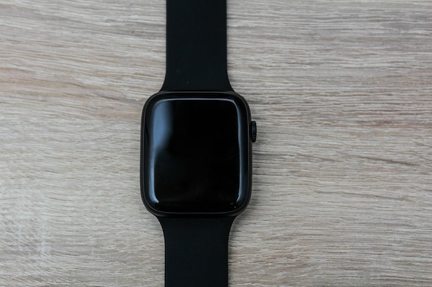 Close up shot of a businessmans hand that uses a smart watch to view incoming messages and calls to