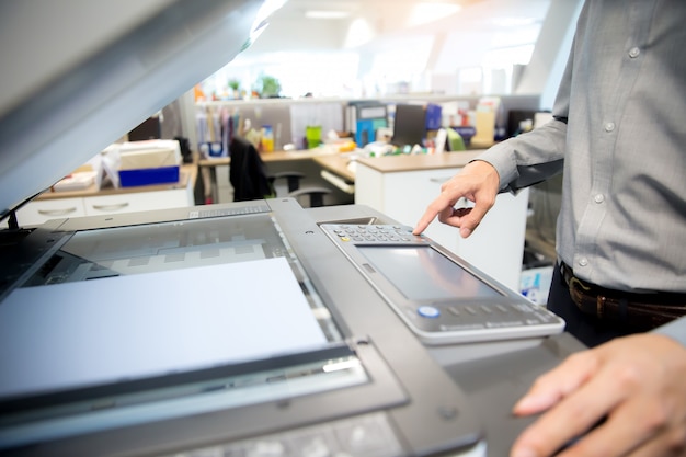 Close-Up Shot Businessmen are using photocopiers.