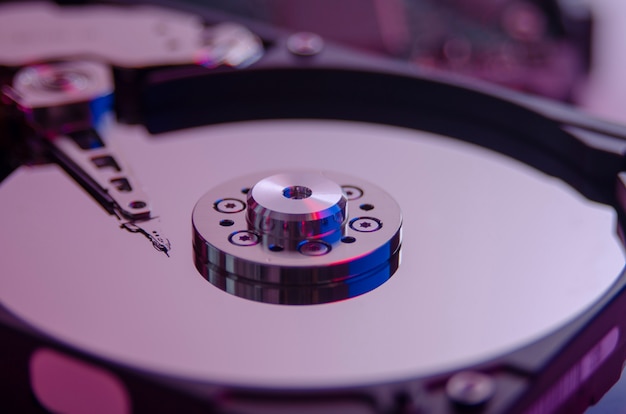 Photo close up shot, colorful disassembled hard drive part of computer