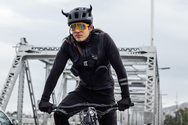 Close up shot of a cyclist with sunglasses riding in the street