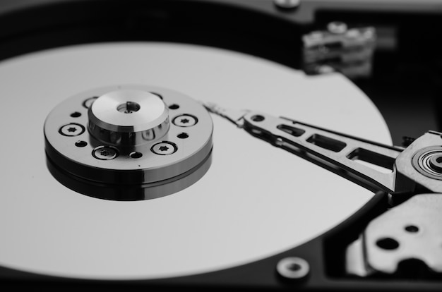 Photo close up shot, disassembled hard drive that part of computer