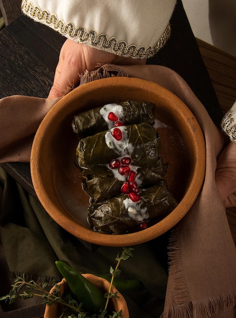 Close up shot of a dolma covered in grape leaves