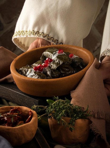 Close up shot of a dolma covered in grape leaves