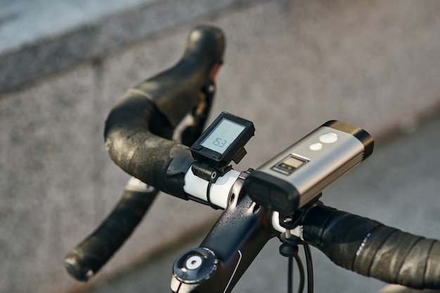 Close up shot of equipment and accessories attached to\
professional bike handlebar