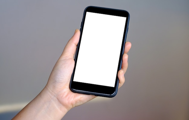 Close - up shot of Hand holding blank screen smartphone.