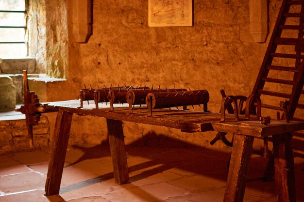 A close-up shot of a historical torture chamber in Beaufort Castle, Luxembourg on a sunny day