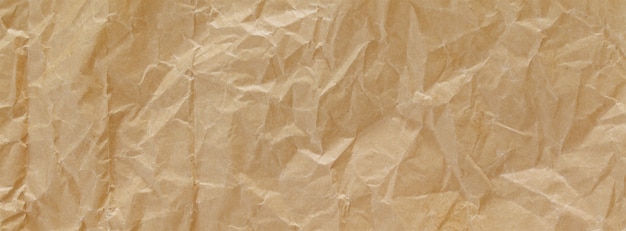 Close up shot of light brown crumpled recycled paper texture background