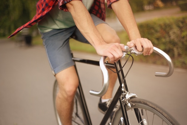 Close up shot of man on bike at the city