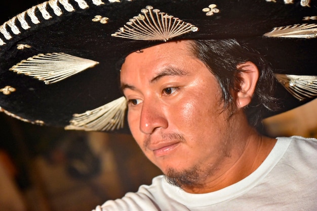 Close up shot of Mexican boy with sombrero