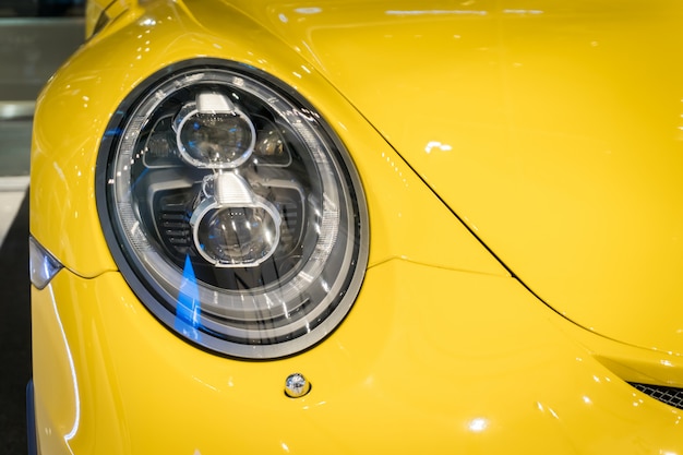 Photo close up shot of a modern car headlight