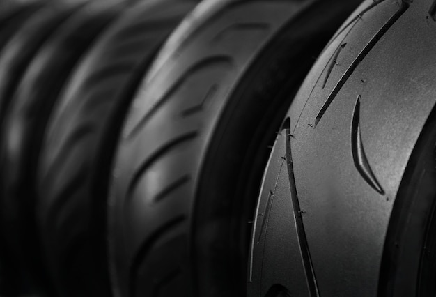 Close up shot of Motorcycle tires on rack store in dark tone