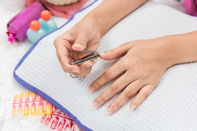 Close up shot of nail cutter, Woman's Finger