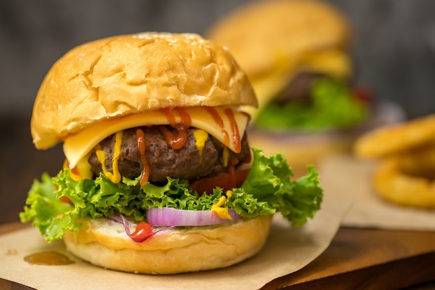 Close up shot of ready to eat homemade beef hamburger with fresh vegetables.