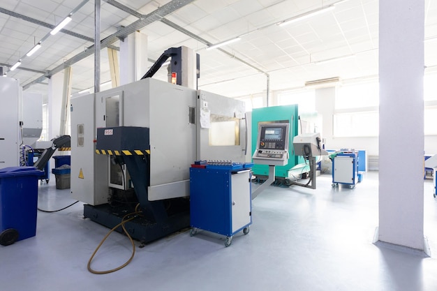 Close up shot of screw cutting machine in factory that makes metal details