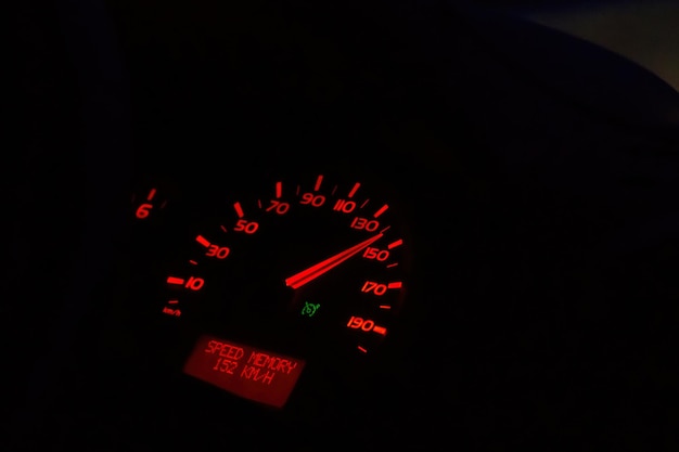 Close up shot of a speedometer in a car high speed