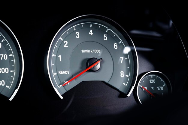 Close up shot of a tachometer rounds of the engine per minute in a car