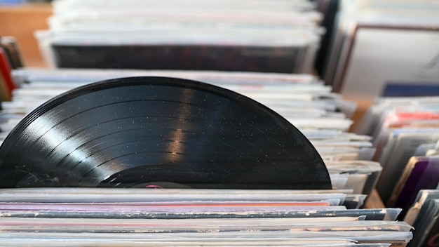 Close up shot of vinyl record in stack