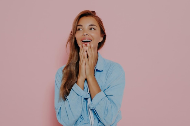 Close up shot of woman with delightfully surprised look