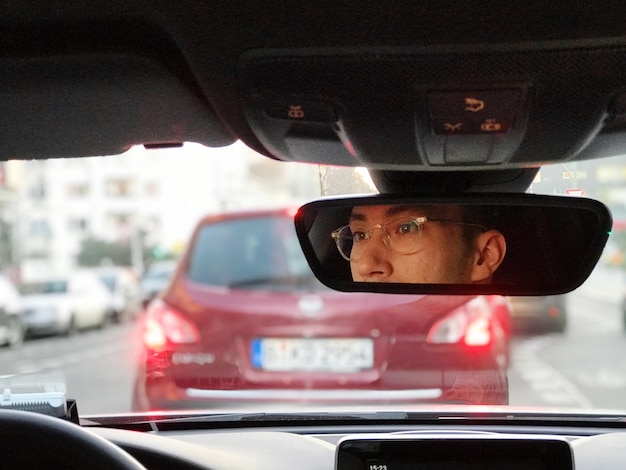 Close-up of side-view mirror of car