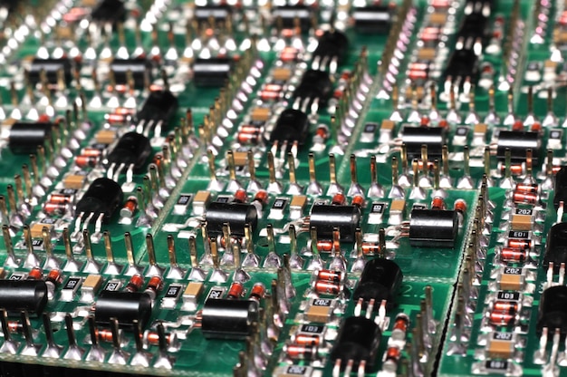 Close-up side view of a PCB board with SMD components