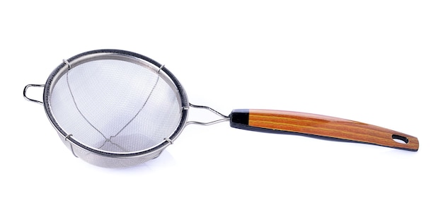Close-up of sieve over white background
