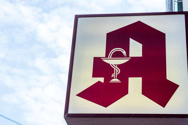 Close-up of sign against sky