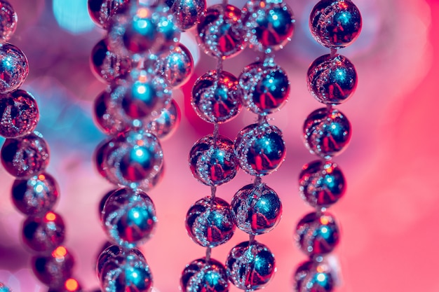 Close up of silver beads. christmas and holiday decoration concept