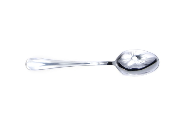 Close up on silver spoon isolated