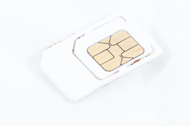 Photo close-up of sim card over white background