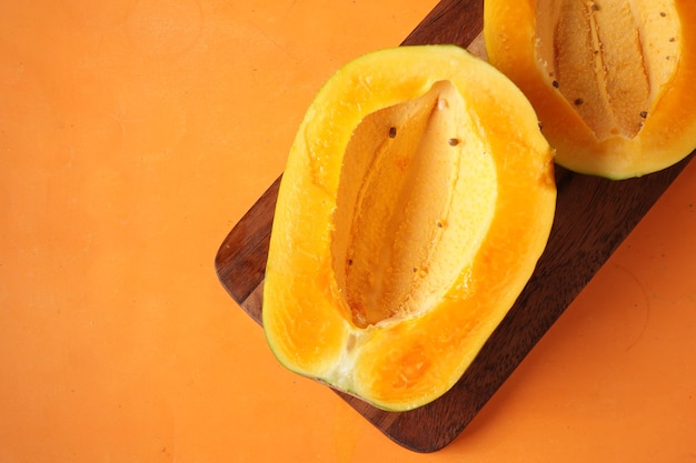 Close up of slice of papaya on plate