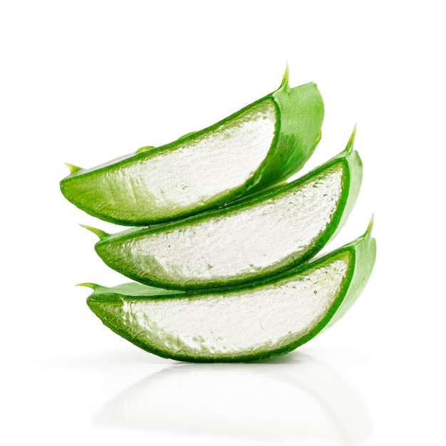 Close up of sliced aloe vera leaf isolated on white background. Alternative medicine concept