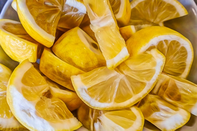 Close up sliced lemons in plate