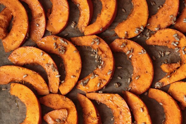 Close up of sliced pumpkin on baking sheet