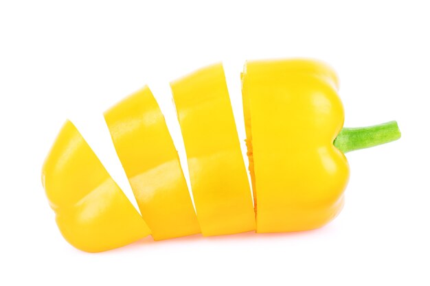 Close up of sliced yellow pepper on a white background