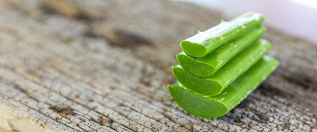 Close-up slices green aloe vera stack.