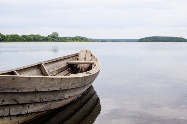 Close up on small boat on the crystal lake