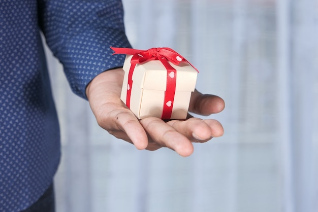 Close up of small gift box on hand.