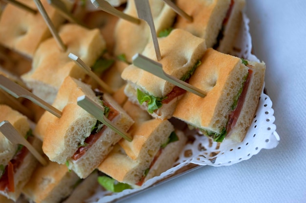 Close up of small sandwiches on a buffet