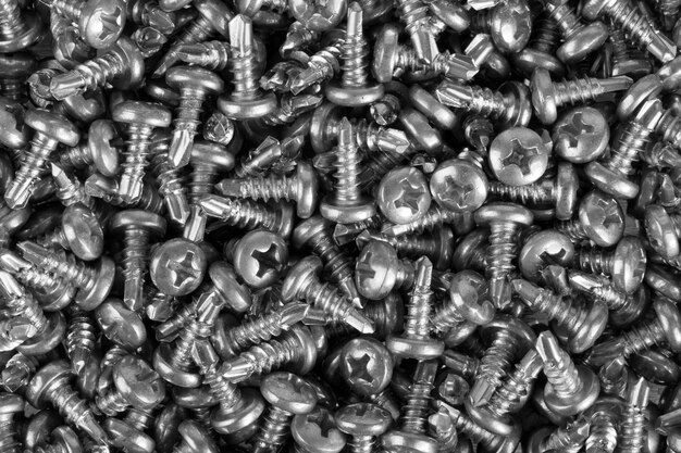 Photo close-up of small screws. background or texture