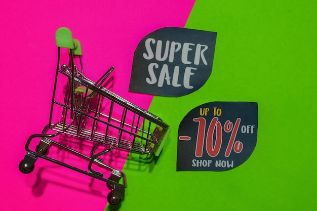 close-up of small shopping cart with text