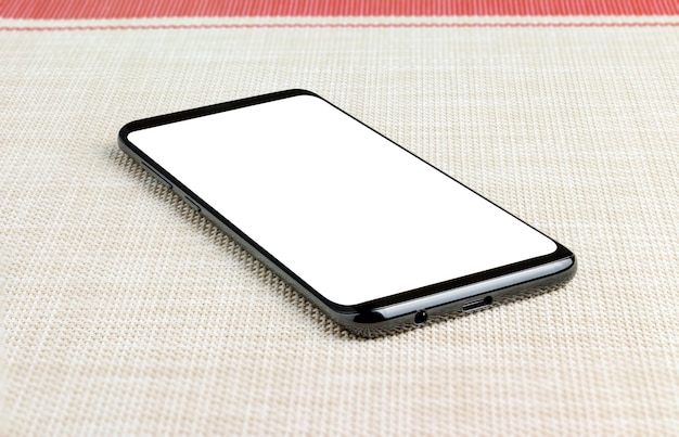 Close-up of smart phone on napkin