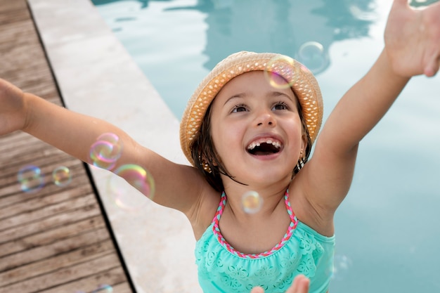 Close up smiley girl at pool