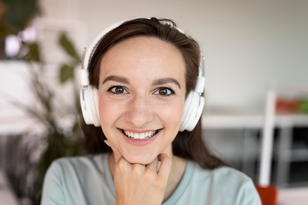 Close up smiley woman with headphones