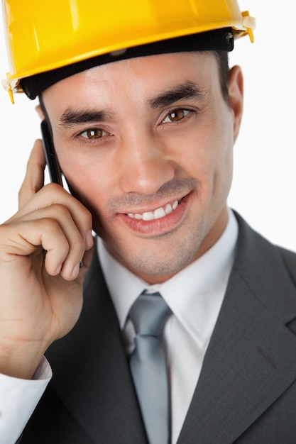 Close up of smiling architect listening to caller