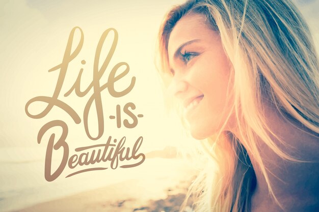 close up of a smiling blond looking away at beach