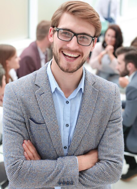 Close up smiling business man on the background of the office