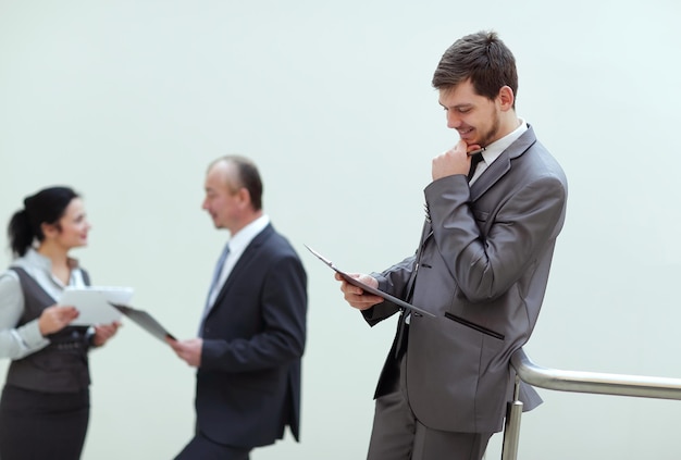 Close up smiling businessman reading business document