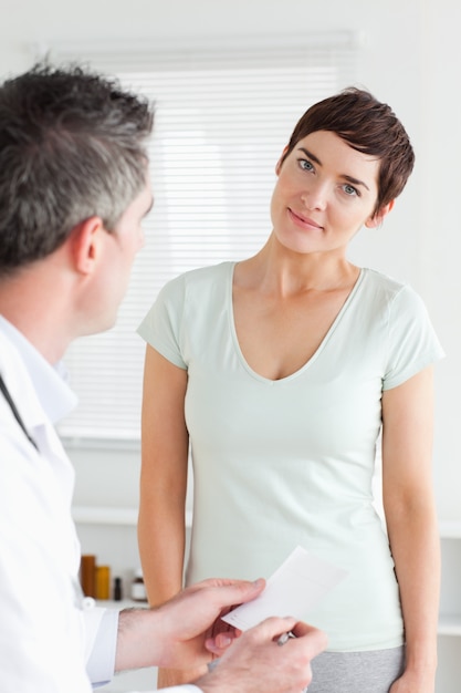 Close up of a smiling Woman receiving a prescription