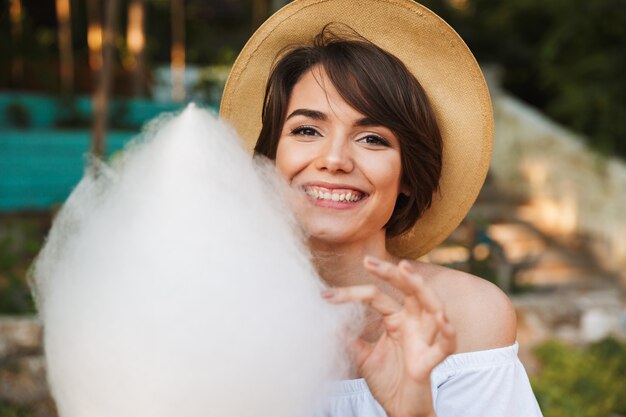 Close up of smiling young girl dressed in summer clothes